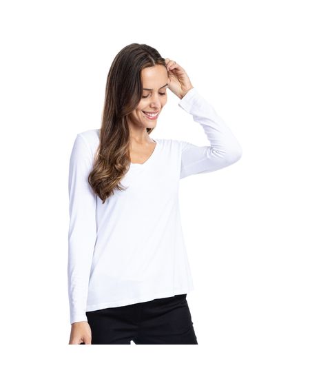 Mulher vestindo blusa feminina gola v branca manga longa | Camisaria Colombo